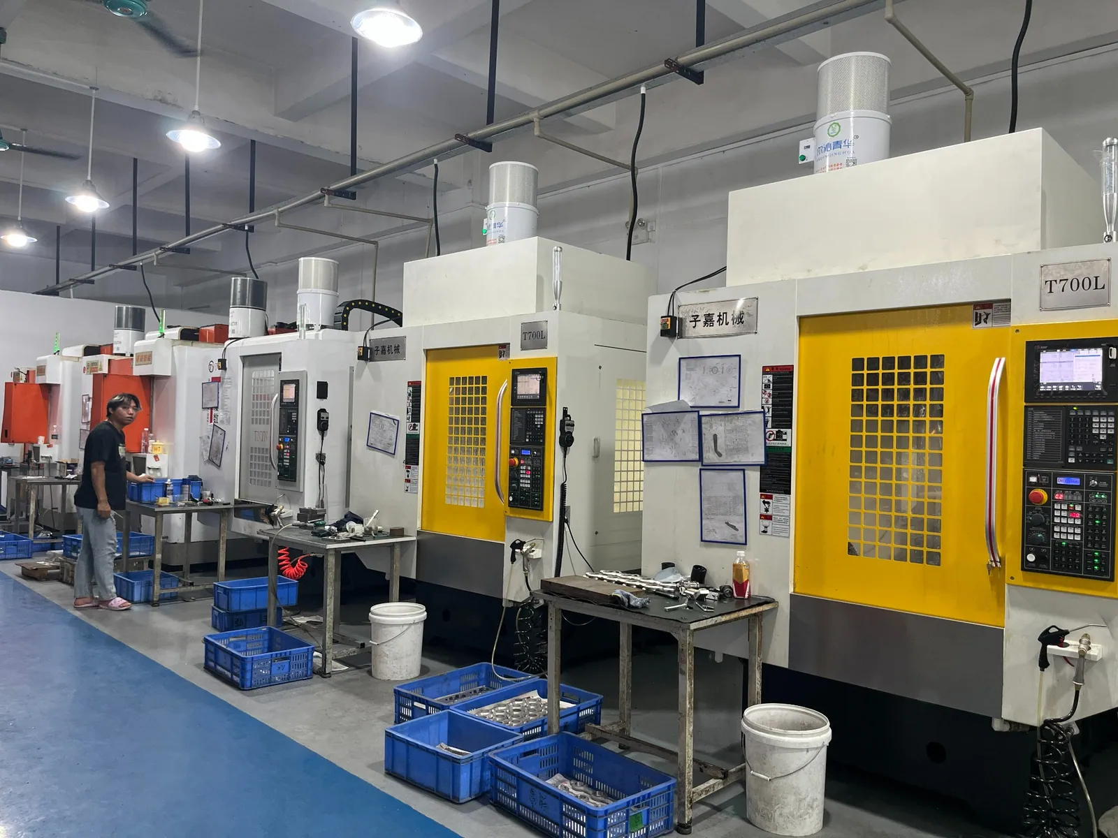 A row of machines in the QUANYING CNC workshop